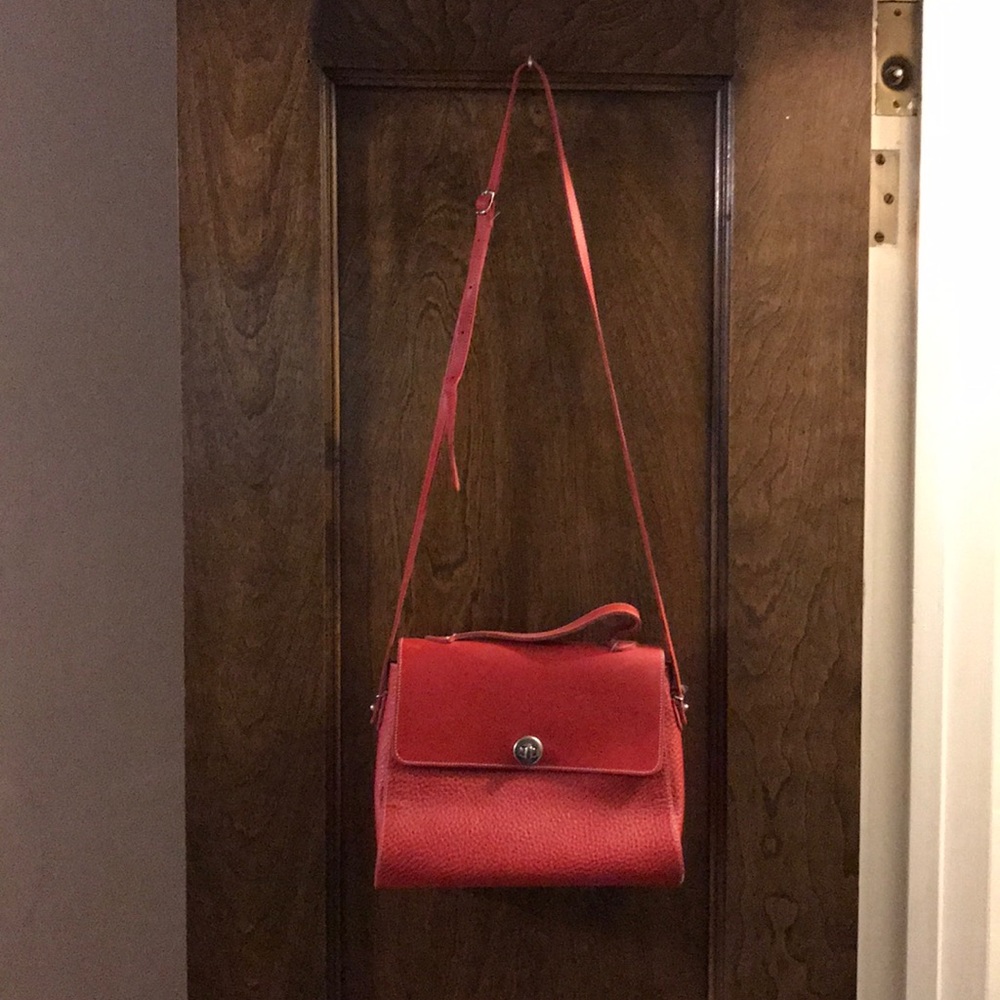 Red leather handbag with crossbody strap